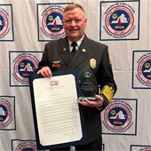 Chief Eddie Ferguson with award